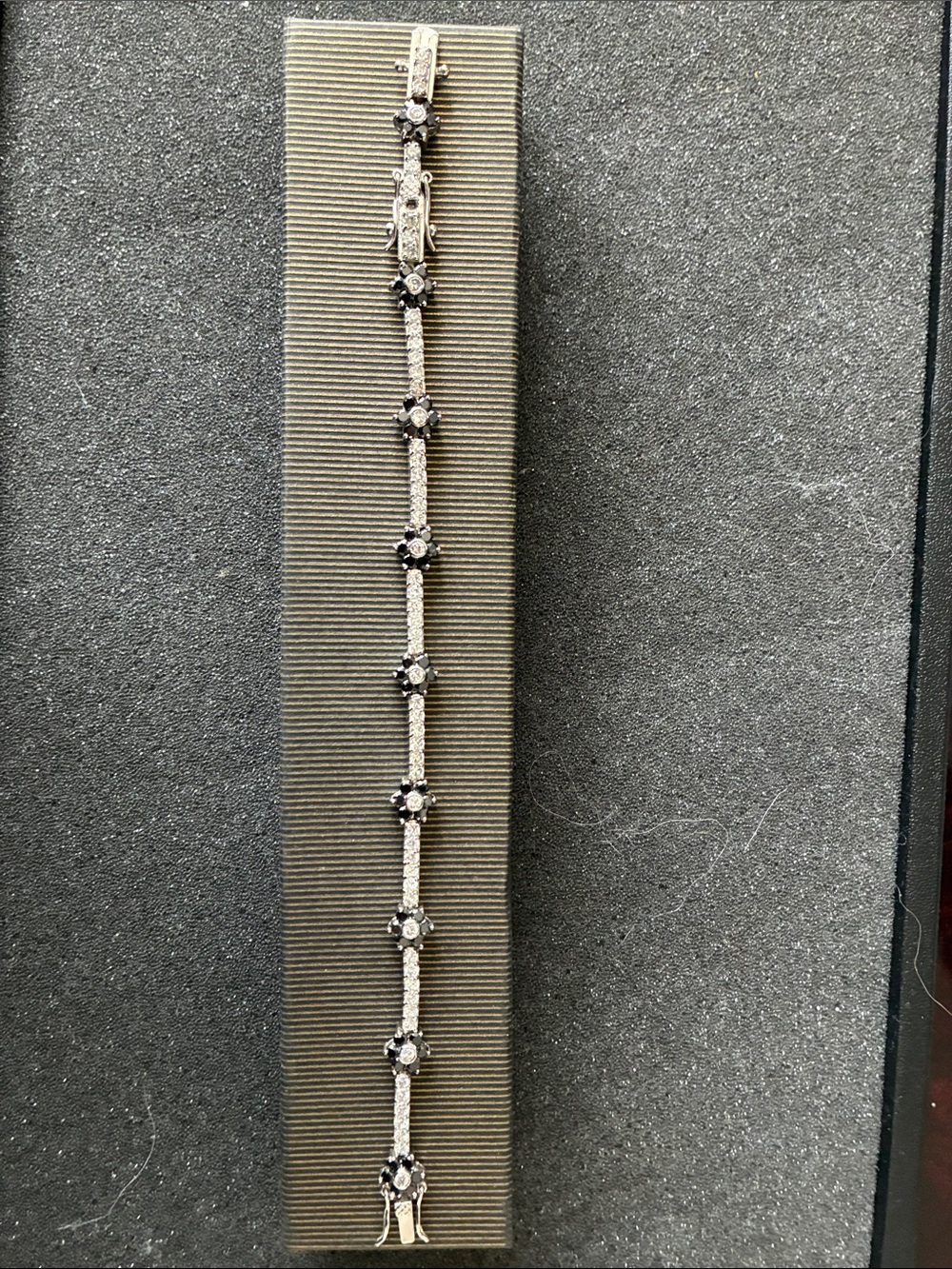 Lia Sophia Silver-tone Bracelet with Black Flower Accents